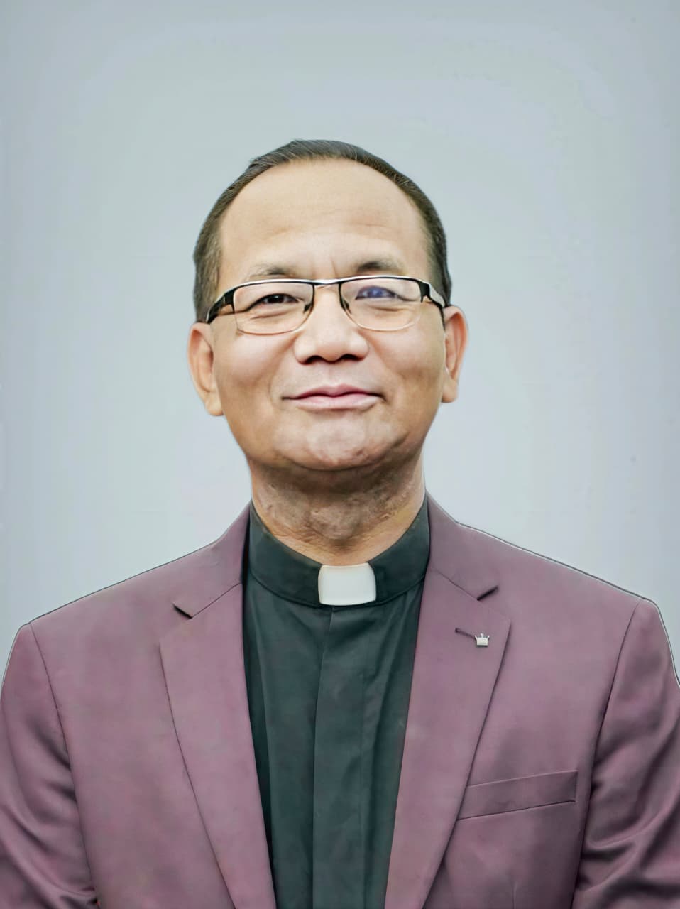 Official photograph of Rev. Lalfakzuala, Principal of Missionary Training College